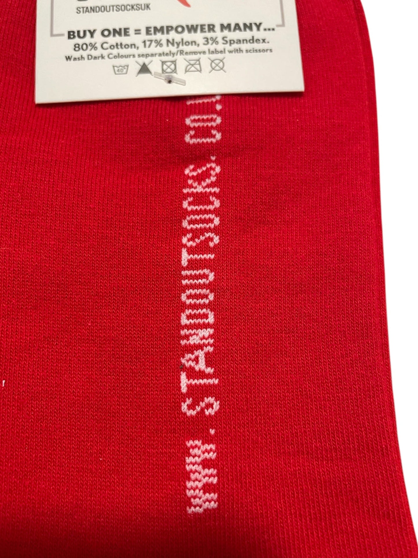 Red sock with white text and a label on a white background