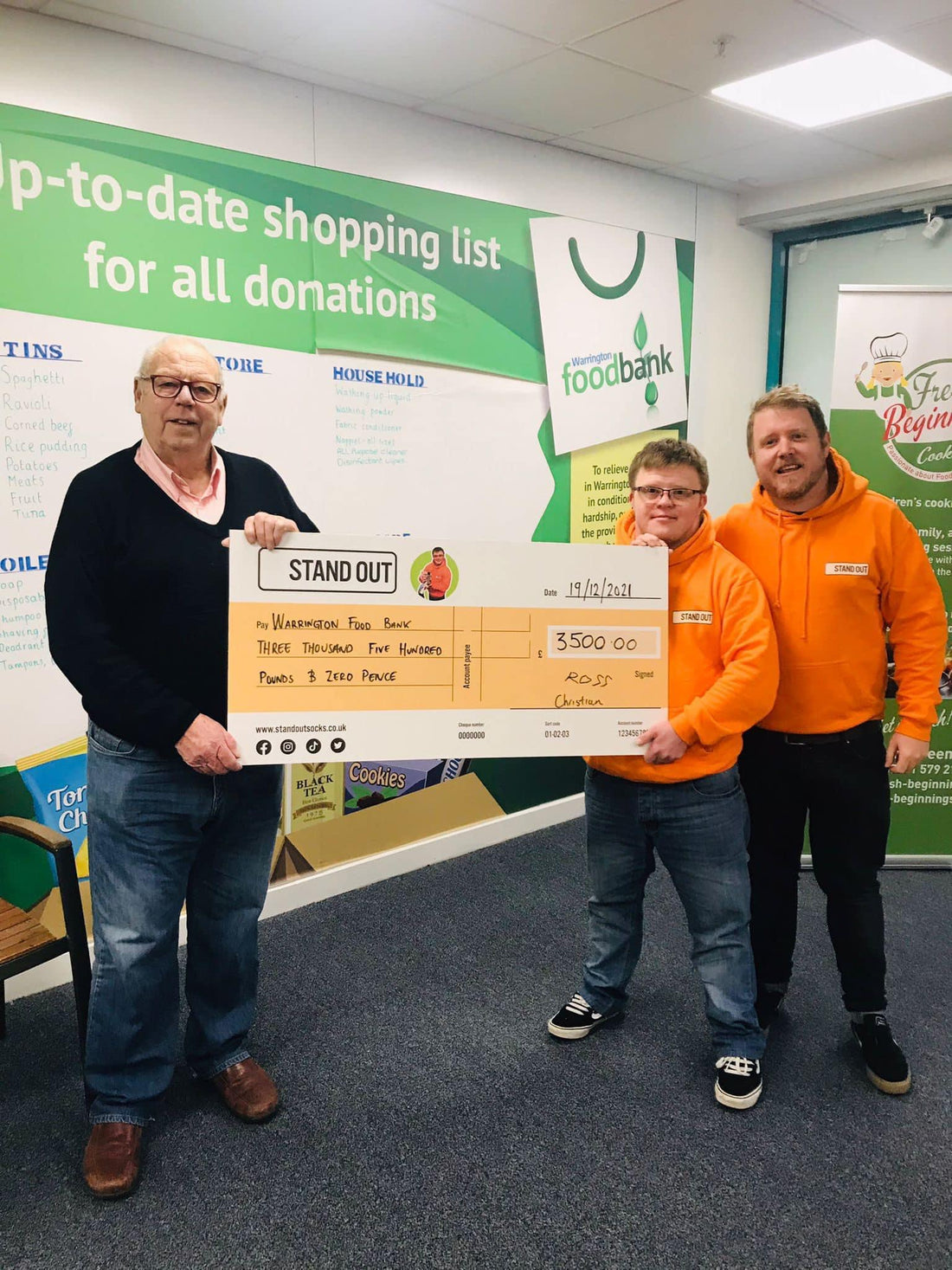 Stand out socks donate £3,500 to Warrington food bank 