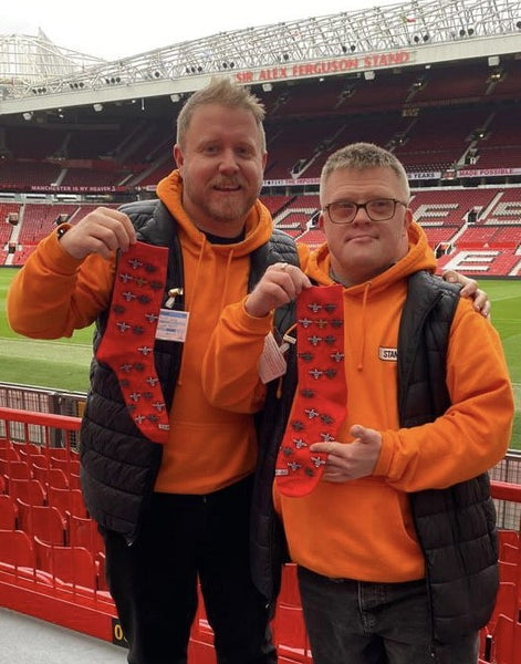 MANCHESTER UNITED IS SUPPORTING STAND OUT SOCKS FOR WORLD DOWN SYNDROME DAY