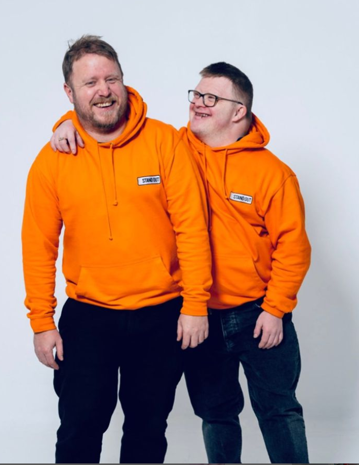 stand out socks co founders photoshoot for Down Syndrome Awareness month