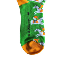 Load image into Gallery viewer, Vibrant photograph of a horse and jockey in action, featuring eye-catching orange and green socks, adding a touch of excitement and energy to the race
