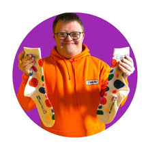 Load image into Gallery viewer, Man holding smiley face socks
