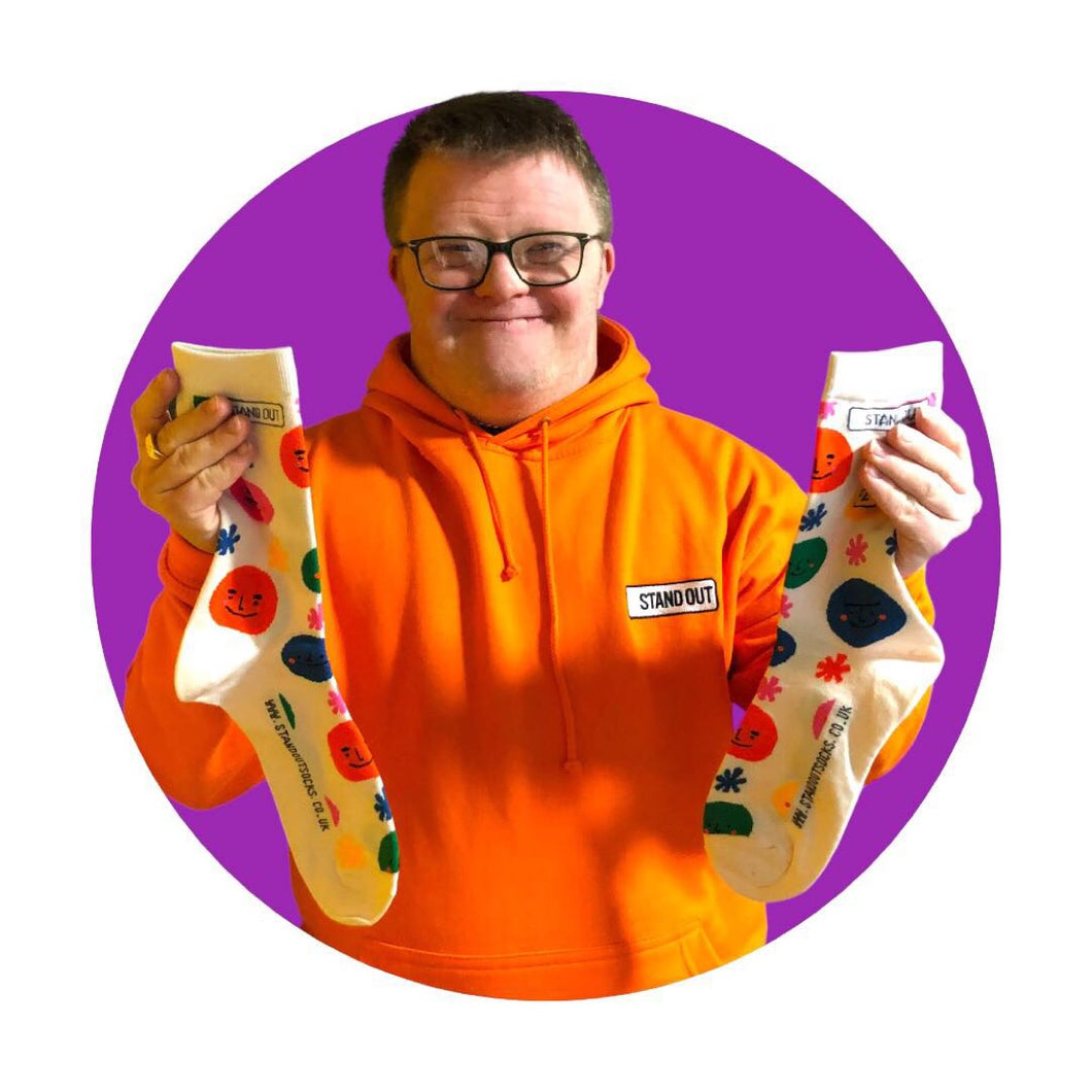 Man holding smiley face socks