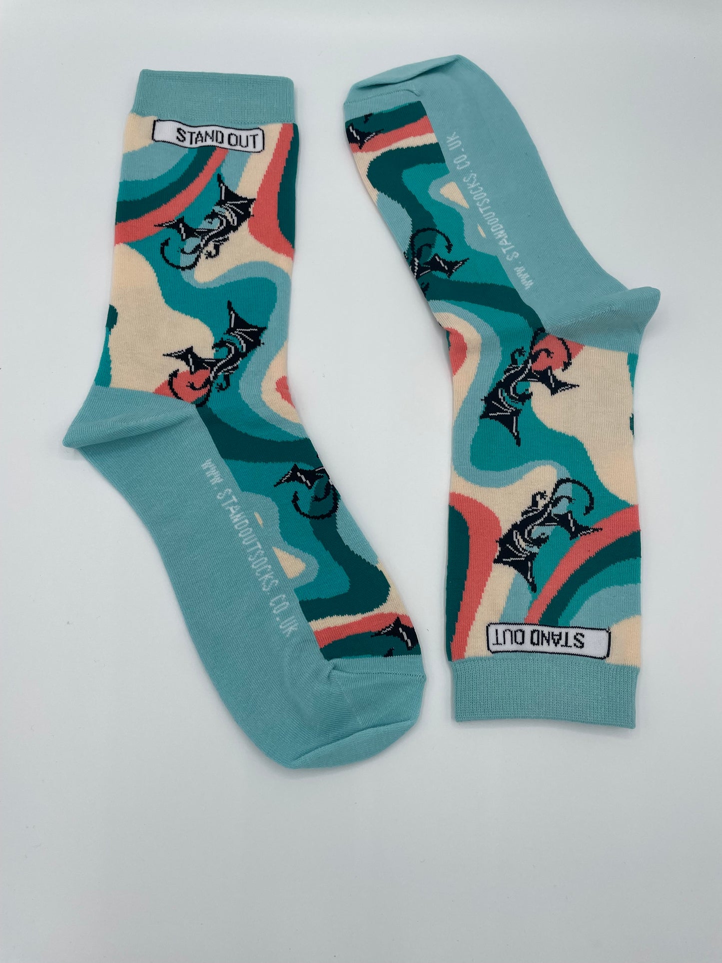 Pair of socks with abstract design and brand logo on a white background