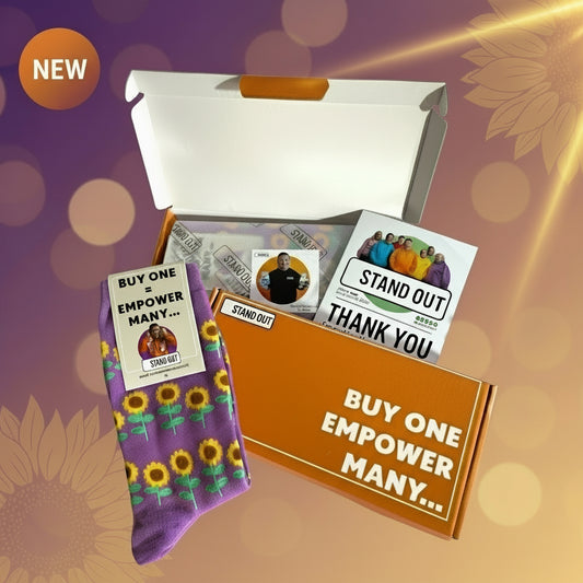 Product packaging with socks, cards, and a box on a decorative background