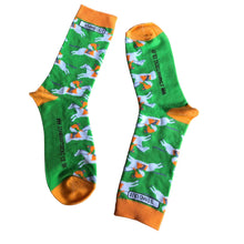 Load image into Gallery viewer, Vibrant photograph of a horse and jockey in action, featuring eye-catching orange and green socks, adding a touch of excitement and energy to the race
