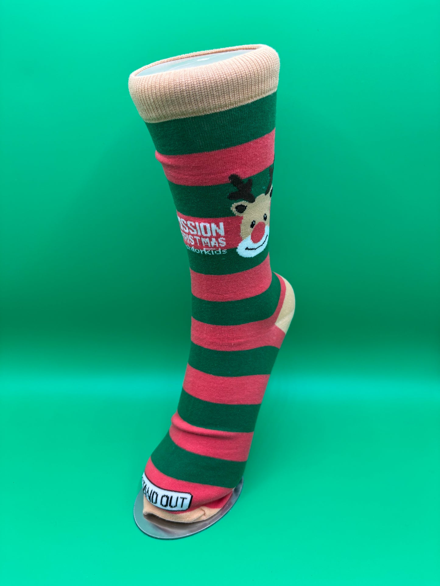 Green and red striped dog toy with brand logo on a green background