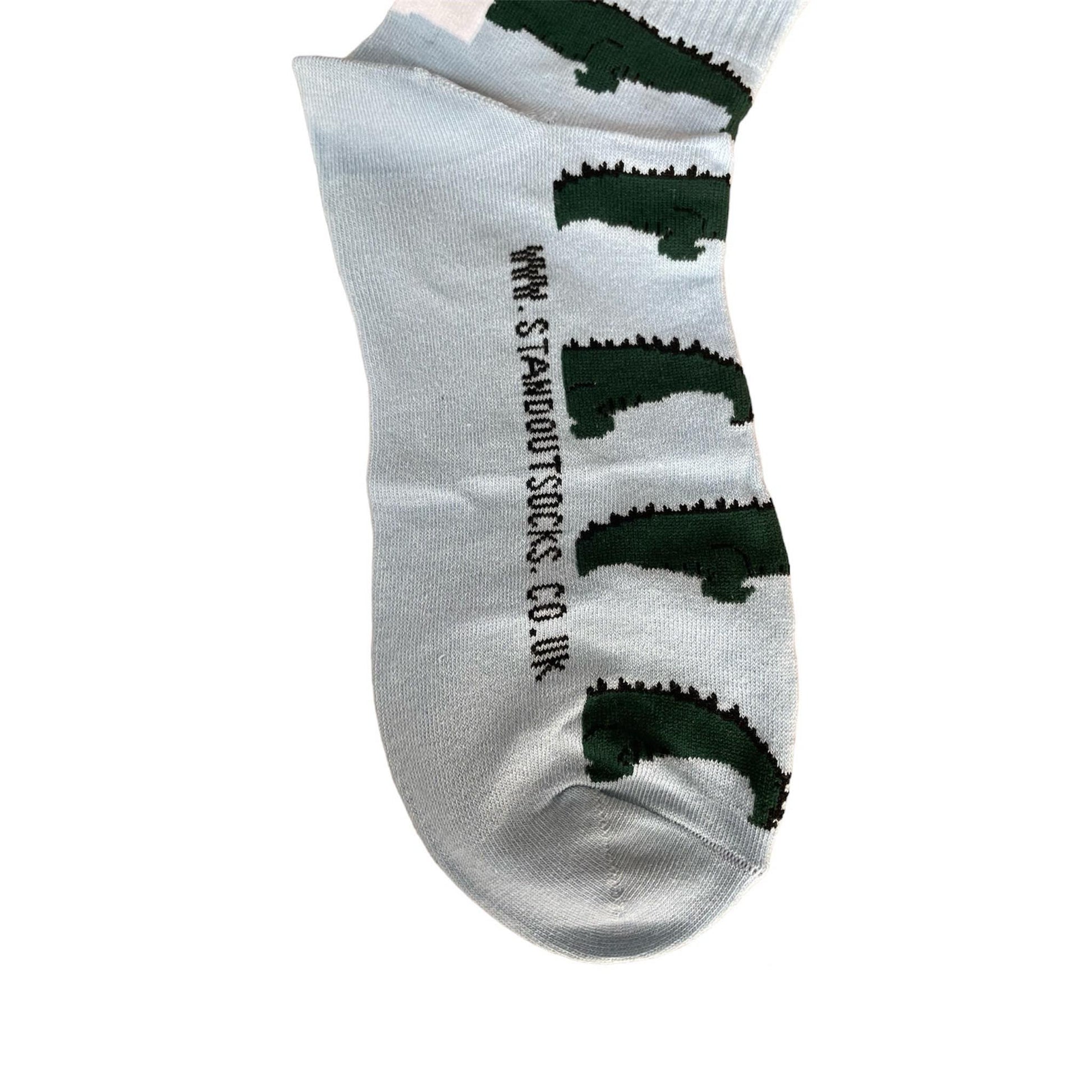 Close up of a colourful  Stand Out Sports Socks with a Blue and Green Crocodile Pattern.