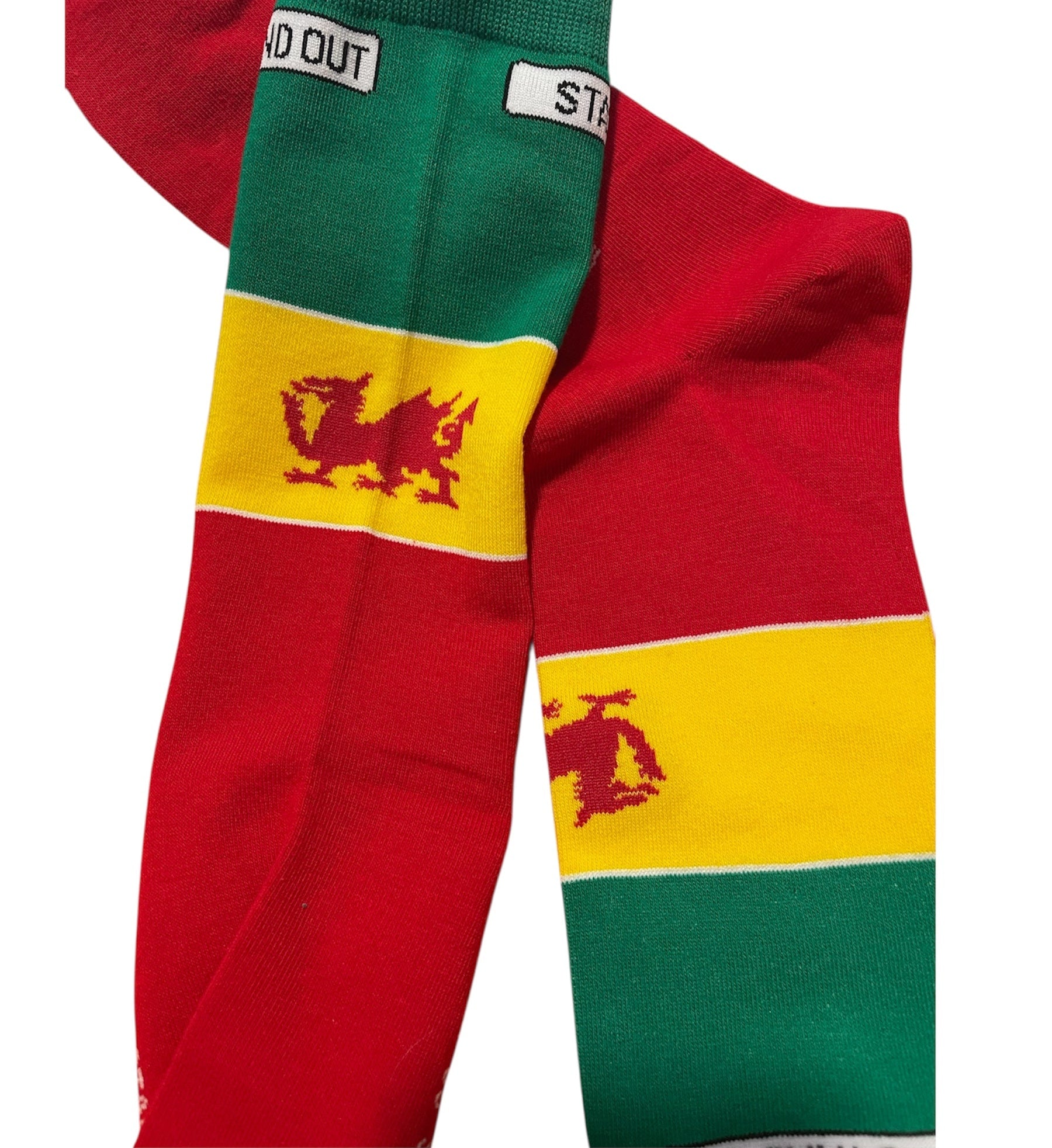 Colourful Welsh Flag inspired socks with a dragon design on a white background