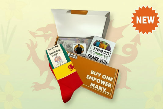 Colourful Welsh flag inspired socks, Orange display box and flyer on a white background. 