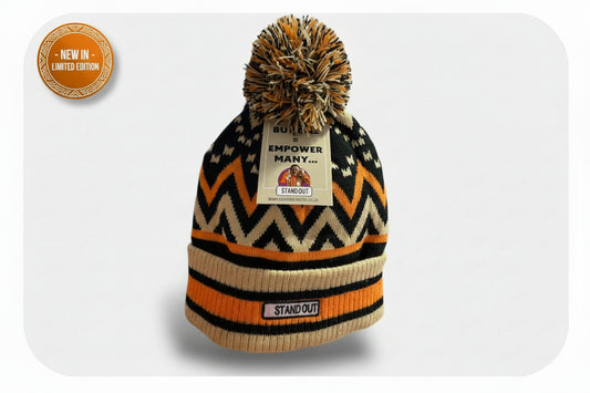 Pom pom hat with a label on a white background, text indicating launch date and limited edition status.