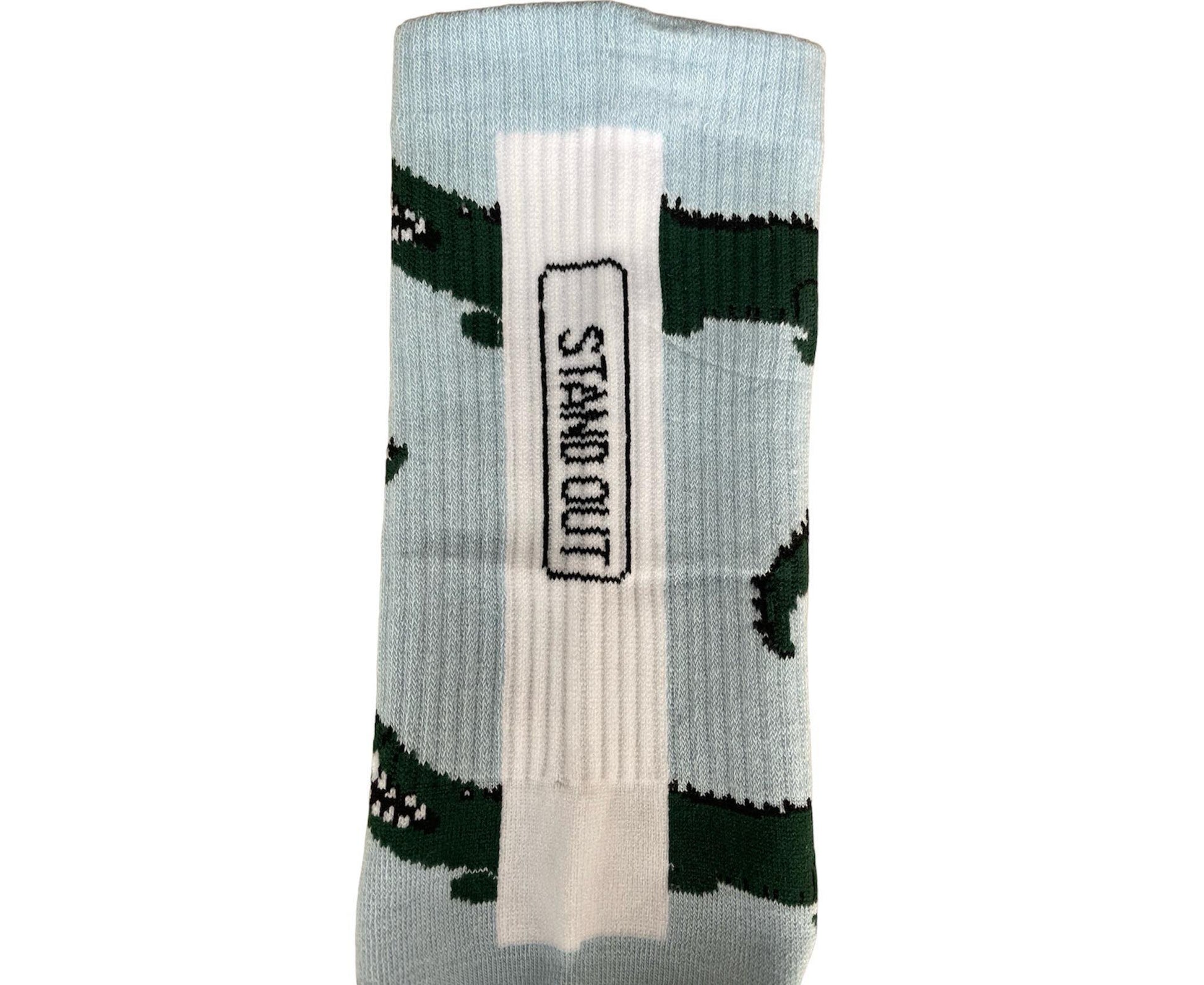 A Close up of colourful Stand Out Sports Socks with a Blue and Green Crocodile Pattern.