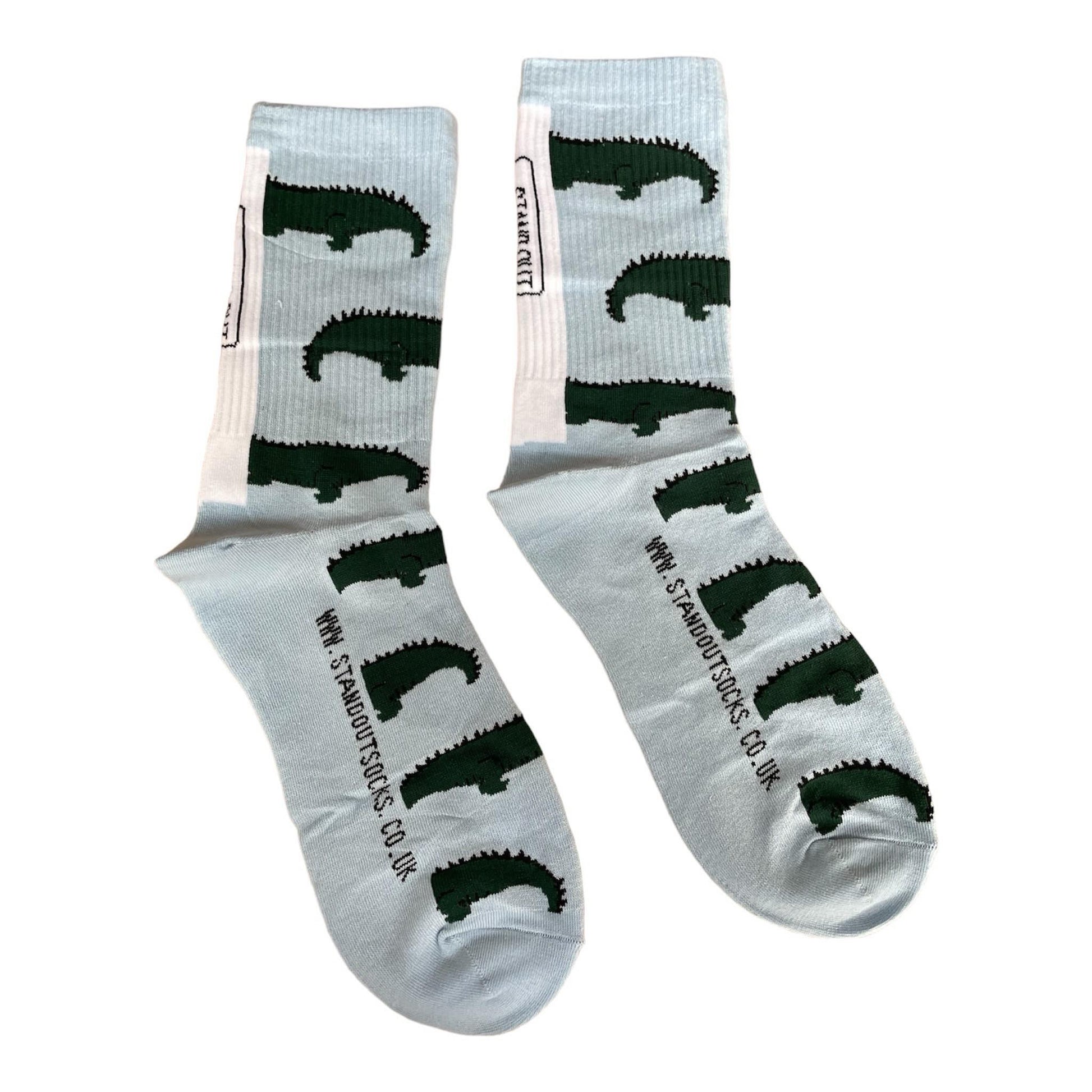 A colourful pair of Stand Out Sports Socks with a Blue and Green Crocodile Pattern.