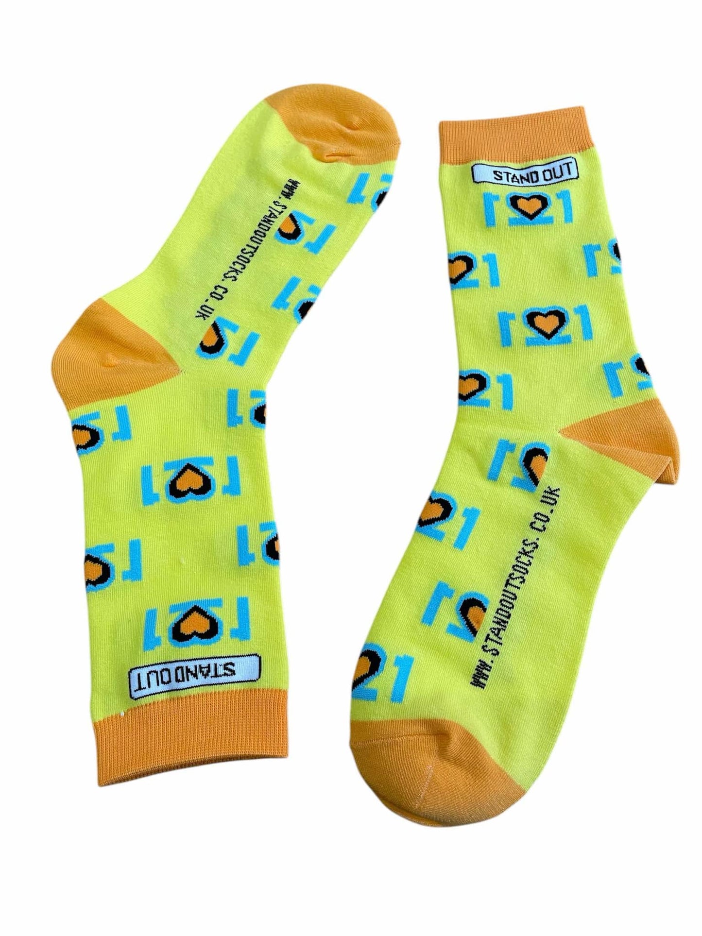 The Official World Down Syndrome Day Stand Out Socks which are yellow, blue and orange, feature a design that incorporates the number 21 mirrored to form three hearts at the centre, symbolising the triplication (trisomy) of the 21st chromosome, which causes Down syndrome.